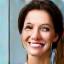 Headshot of a smiling female CEO.